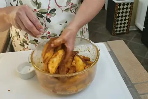 Add the potato wedges to the bowl