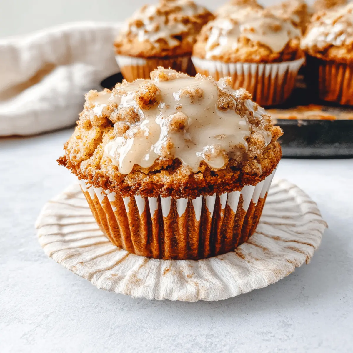 The Best Pumpkin Cinnamon Roll Muffins Ever with Streusel Topping