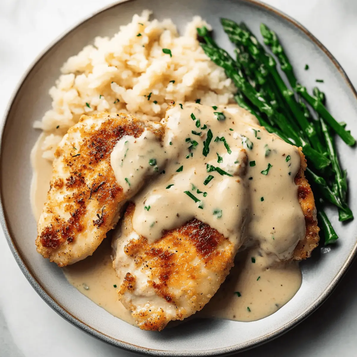 Crispy Parmesan Chicken with a Creamy Garlic Cream Sauce Recipe