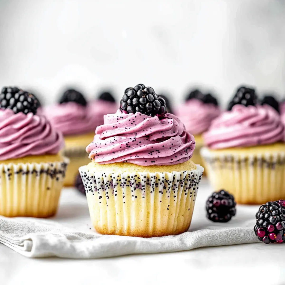 Lemon Poppy Seed Cupcakes with Blackberry Frosting